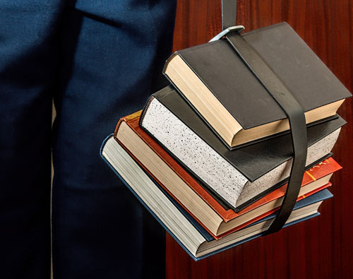 Books hanging by strap